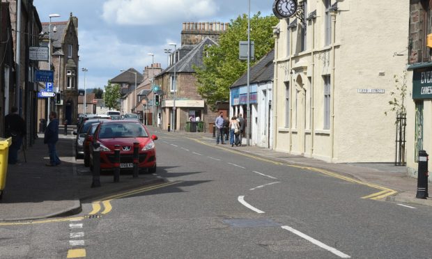 Cars parked along Grant Street in Inverness