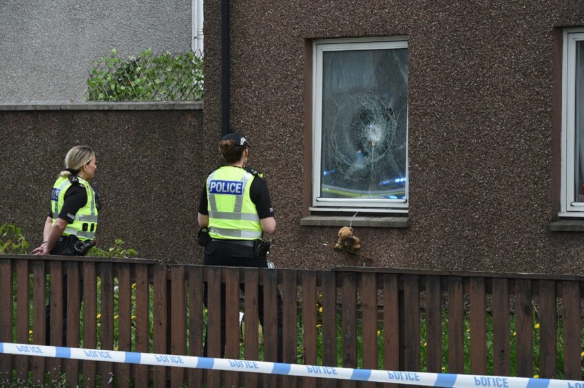 Shattered window at Inverness house