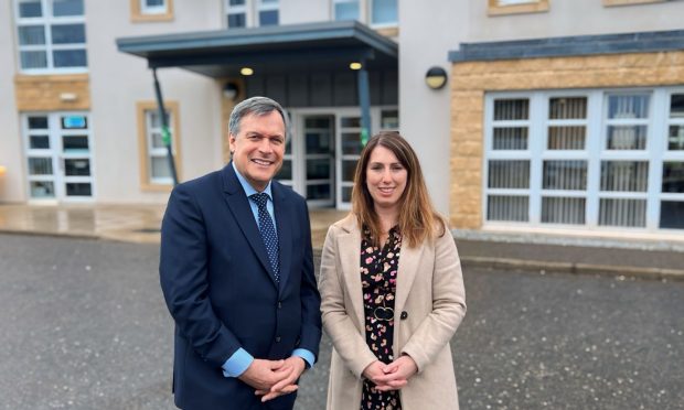 Parklands boss Ron Taylor and Deveron House manager Ruth Smith outside the group's new care home in Huntly.