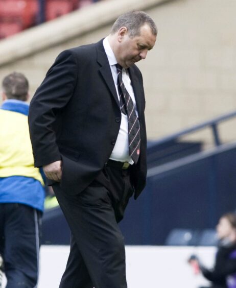 A despondent Jimmy Calderwood following the Scottish Cup semi-final loss to Queen of the South. 