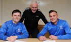 Strathspey Thistle manager Bobby Beckwith, centre, with signings Conor MacPhee, left, and Jordan Laidlaw, right. Image: Strathspey Thistle.