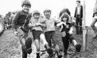 1979: Welly boots were a must at the show ... and in their element as they slush through are, from left, Lesley Low (6), Turriff; Lewis Stewart (10), Rothienorman; David Low (7) and Amanda Rainger (4), both Turriff.
Image: DC Thomson