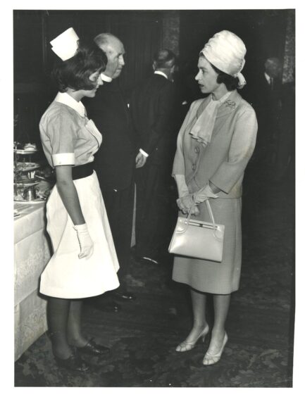 Queen Elizabeth meets Nurse Margaret Pauline during her visit to Aberdeen to sound the all clear in the typhoid outbreak on June 27, 1964.