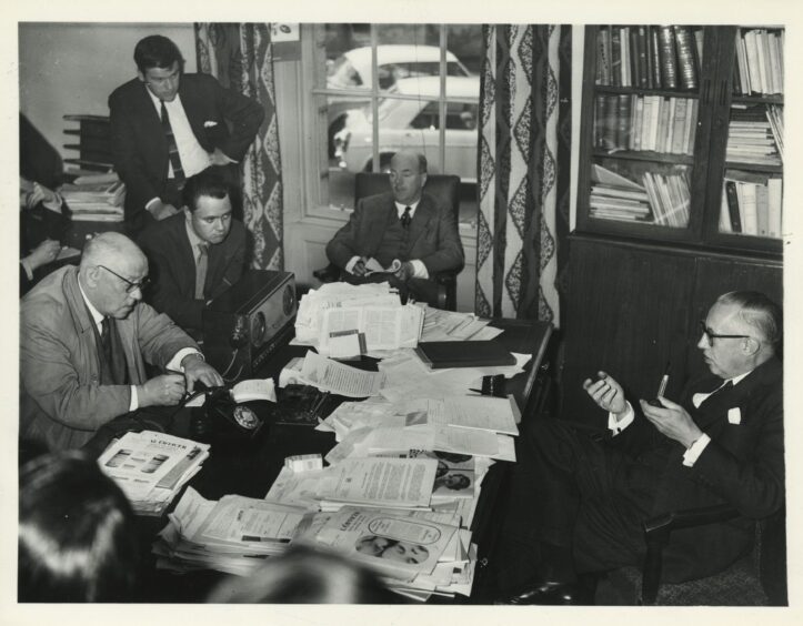 Medical Officer of Health Dr Ian MacQueen at his desk facing the press during the Aberdeen typhoid epidemic of 1964.