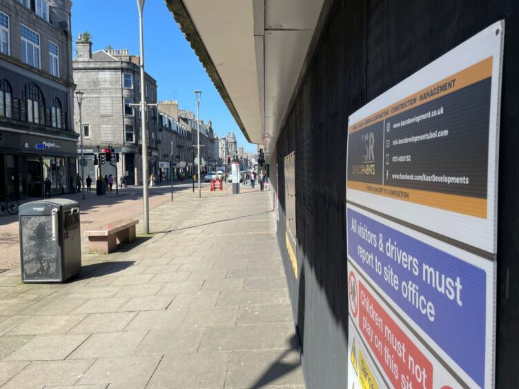 The view up George Street from the boarded up doors of the former John Lewis building in Aberdeen. Image: Ben Hendry/DC Thomson