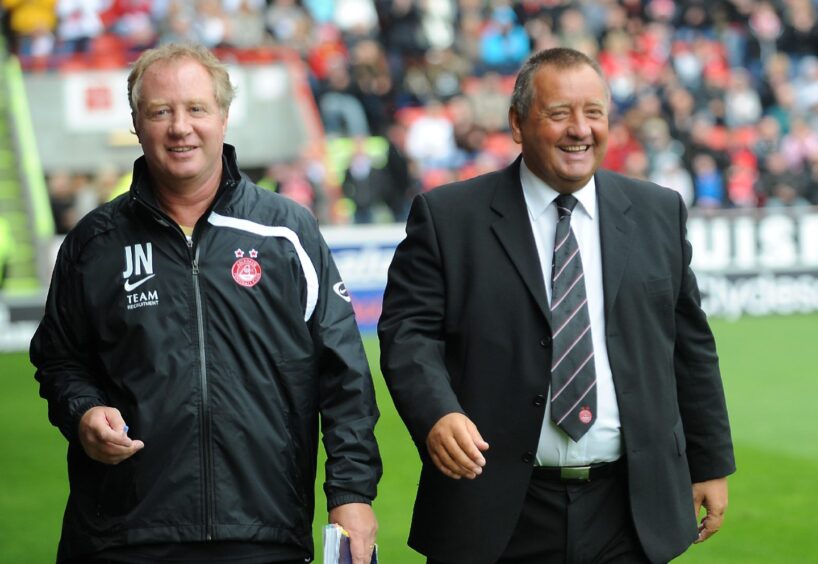 Jimmy Nicholl and Jimmy Calderwood enter the pitch ahead of the Gothenburg Greats match against Manchester United. 12/07/08. Picture by Donna Murray.