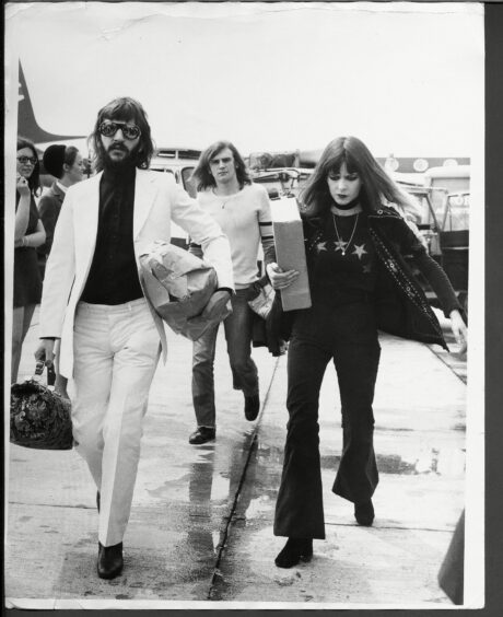Ringo star and his wife Maureen Starkey captured at the airport en route to the wedding.