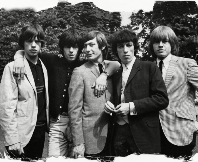 The Rolling Stones posing in a garden in 1964. Left to right, Mick Jagger, Keith Richard, Charlie Watts, Bill Wyman and Brian Jones