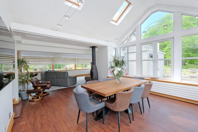 Open-plan lounge and dining area in the house for sale in Mintlaw