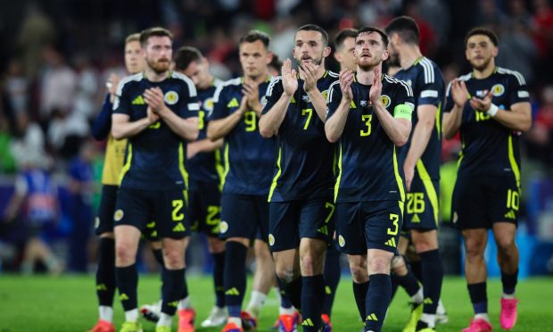 Andy Robertson leads the Scotland players to acknowledge the fans after the game against Switzerland. Image: Shutterstock.