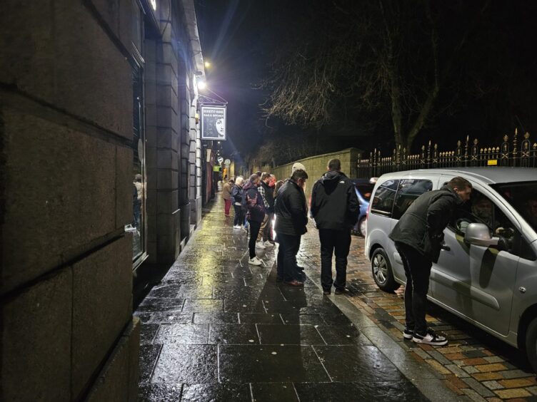 The taxi queue in Back Wynd on a wet February Saturday night. 