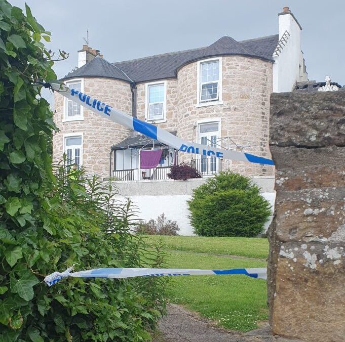 Ladyhill House with police tape in front. 