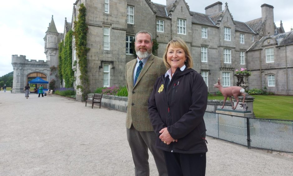 James Hamilton-Goddard, visitor enterprise manager at Balmoral, and curator Sarah Hoare outside Balmoral Castle