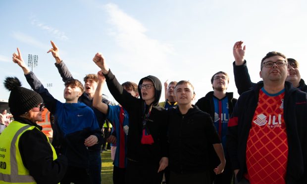 Inverness fans take to the pitch to protest against the board at full time following their play-off defeat by Hamilton. Image: SNS.