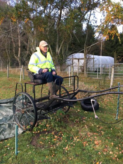 Murray Jamieson from Tain on a carriage. 