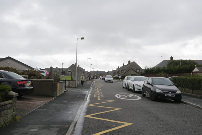 Cars parked on the road outside Fraserburgh South Park School 