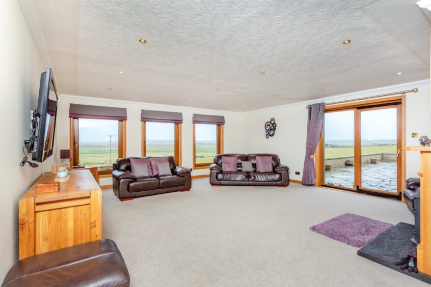 First floor family room with full height windows at Boggy Park, Thurso