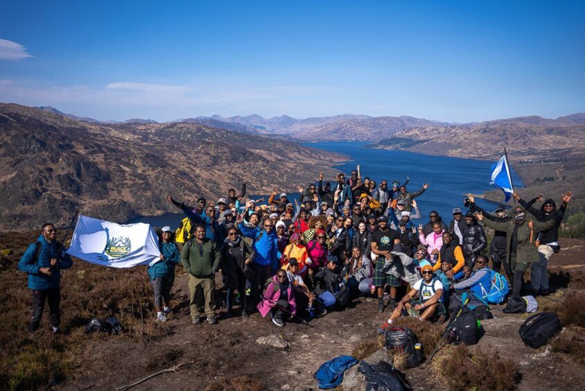  Black Scottish Adventurers members on a summit. 