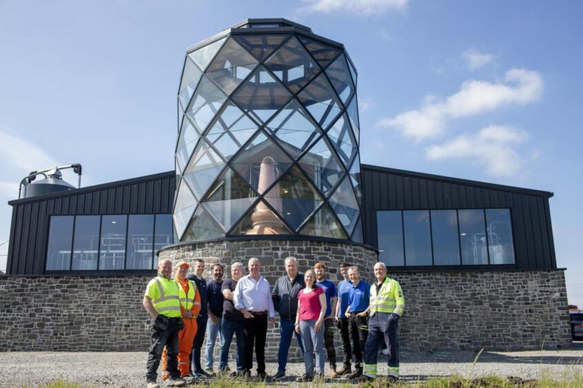 Mr MacMillan, with members of his distillery team outside the building at Gramsdale.