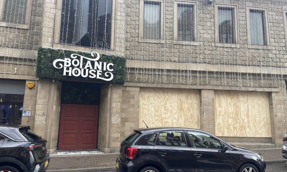 Botanic House in Inverness with the ground floor windows boarded up.