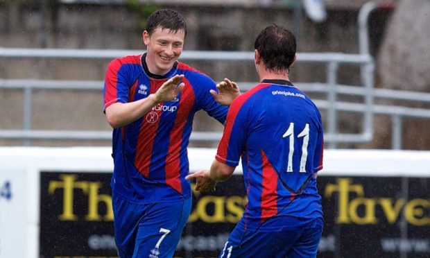 Shane Sutherland is congratulated by team-mate Aaron Doran after scoring in a 3-0 pre-season win at Clach in 2012. Image: Paul Campbell