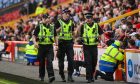 Police patrolling the stadium during the match. Darrell Benns/DC Thomson