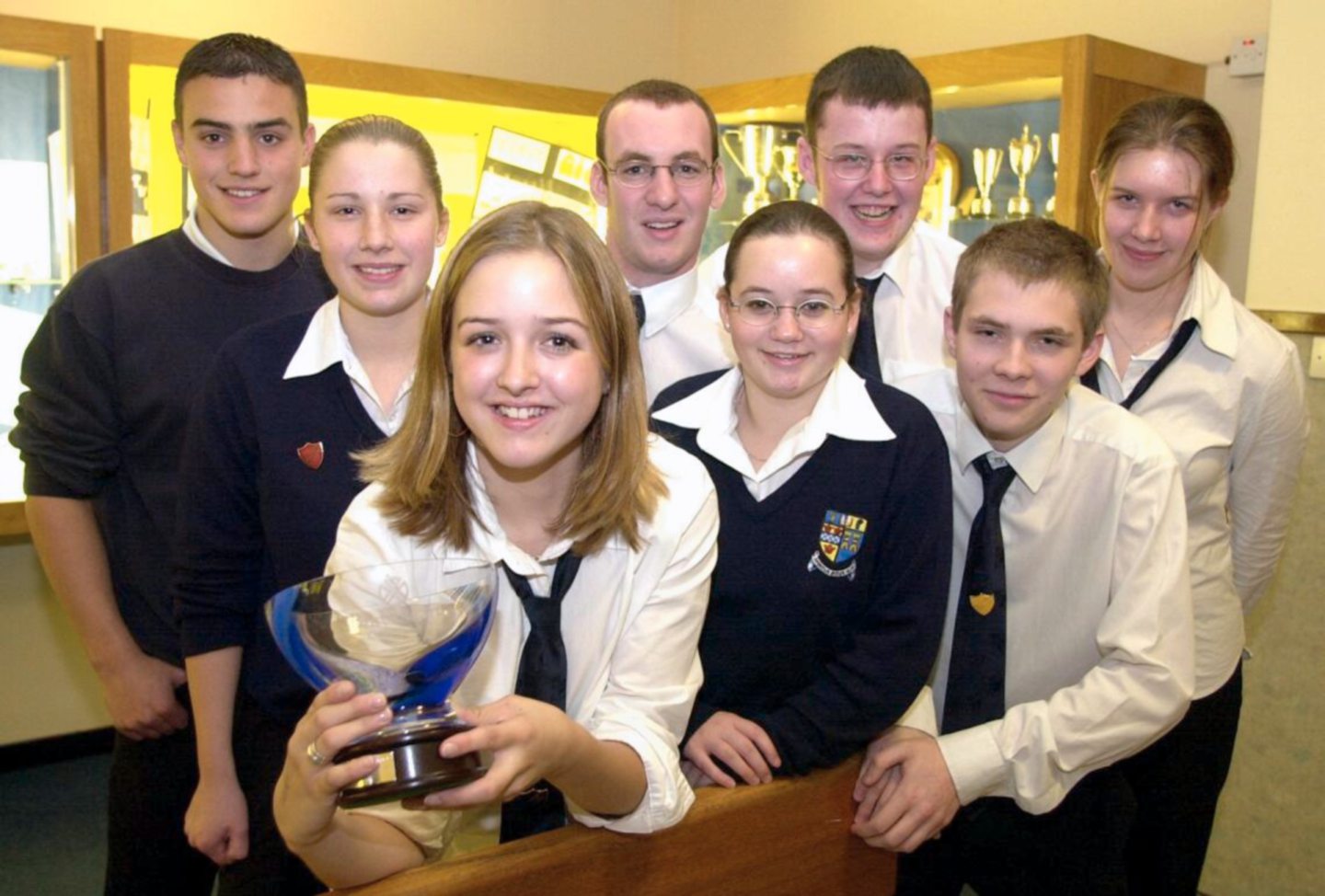 Inverurie Academy pupils posing for photos after receiving a trophy