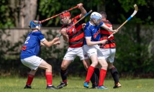 Glenurquhart's John Barr (centre left) and Kyles' James Pringle (centre right) in the thick of the action.