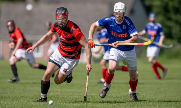 Glenurquhart's Ryan Porter (left) with Innes Macdonald (Kyles).  Image: Neil Paterson.