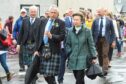 Princess Anne visits the Portsoy Boat Festival, second from left is chairman David Urquhart.. Portsoy. Supplied by Portsoy Boat Festival Date; Unknown