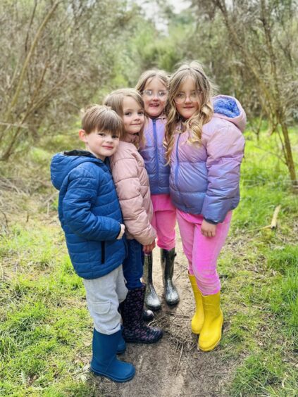 Four of the Sullivan Family kids having fun outside.