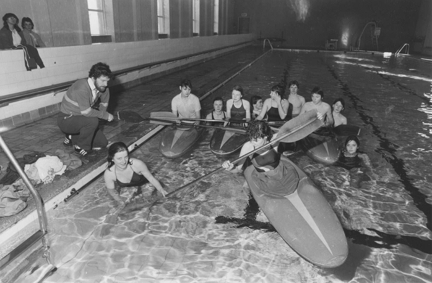 Pupils in kayaks in the pool