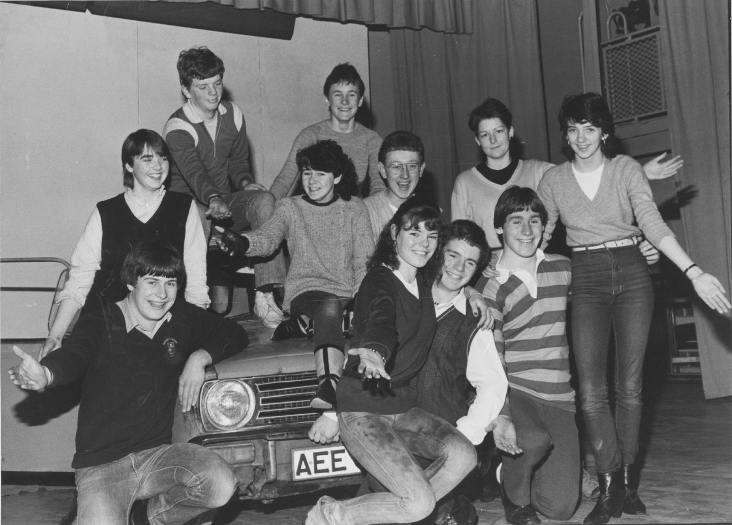 Inverurie Academy cast of their production of Grease posing for photos around the car
