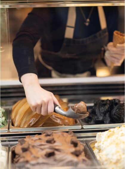 Nicola scooping ice cream at Island Larder.