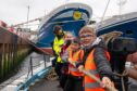 A group put their backs into raising the Reaper's sail. All images: Jamie Ross/DC Thomson