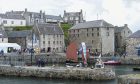 Historic buildings at Portsoy Harbour are now officially in the ownership of local volunteers.