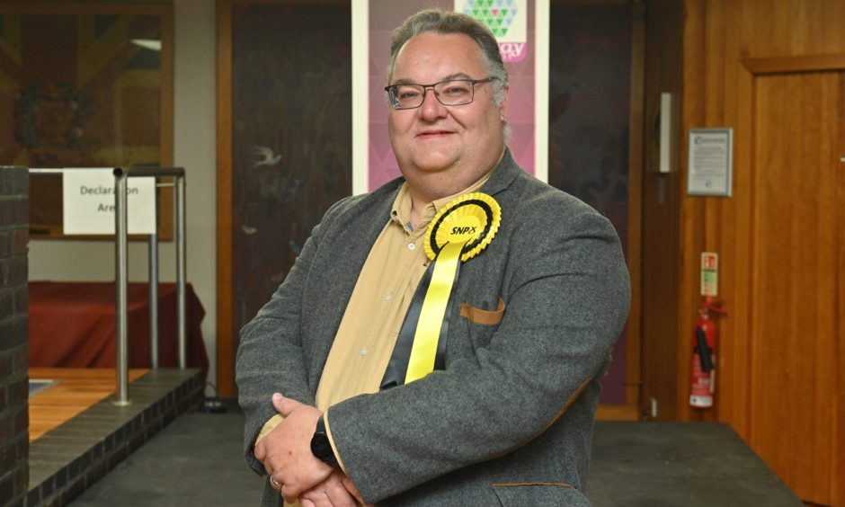 Graham Leadbitter wearing SNP rosette.