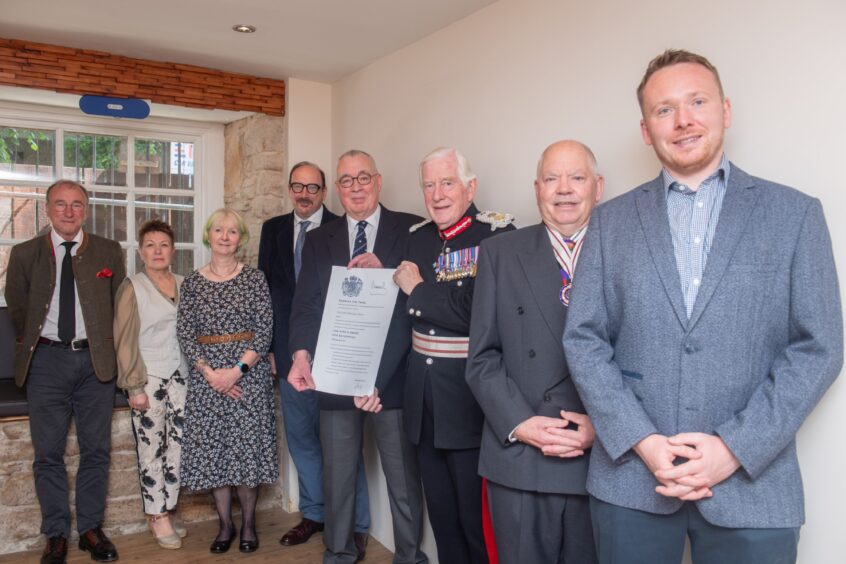 Moray Lord Lieutenant Seymour Monro, third from the right, presents the King's Awards to company founder Stuart Huyton and other members of Gaia Earth Group's team.