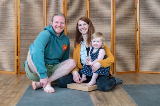 Elgin Yoga Centre's Paul Gibson pictured with his wife Heather Fulton and daughter Noomi Fulton. Image: Jason Hedges/DC Thomson