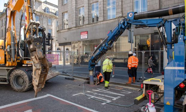 Workers carrying out Union Street roadworks.