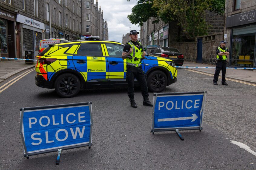 Police officers and car at cordon on Rosemount Place