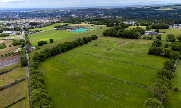 The proposed Cults battery storage site with the playing fields in the background.