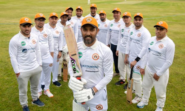 Aberdeen Tigers captain Zakir Hussain, centre, with his team. Pictures by Kenny Elrick/DC Thomson.
