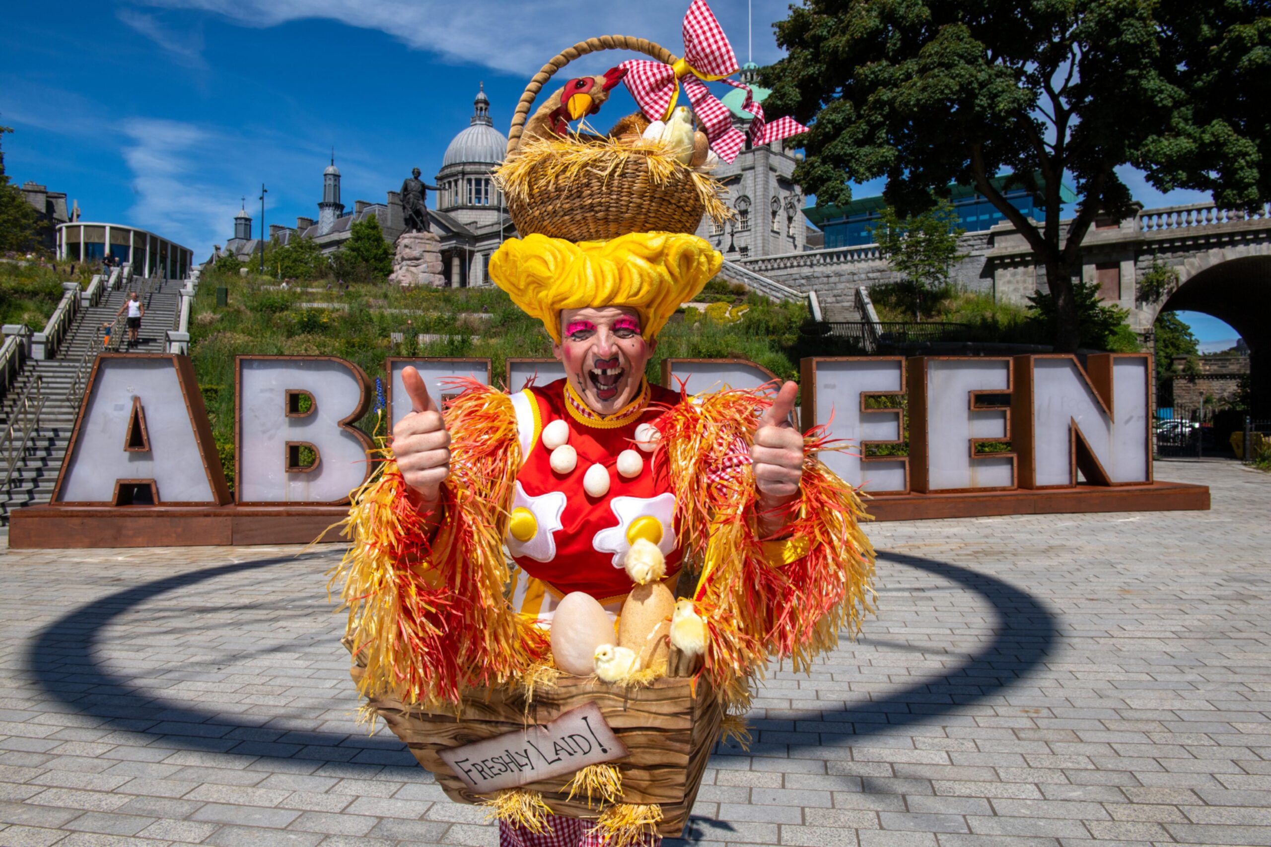 Alan McHugh in front of the Aberdeen sign.