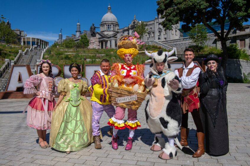 The cast of Jack and the Beanstalk in their colourful costumes
