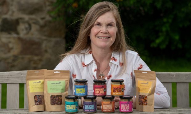 Susan Yule with her Hungry Squirrel product range. Images: Kenny Elrick/DC Thomson