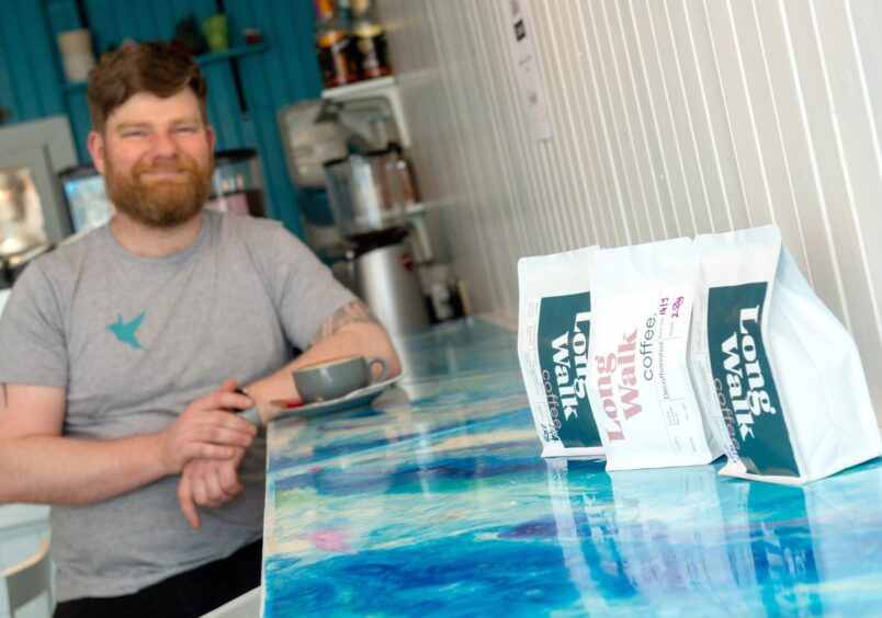 Colin and his Long Walk Coffee at the cafe in Banchory. 