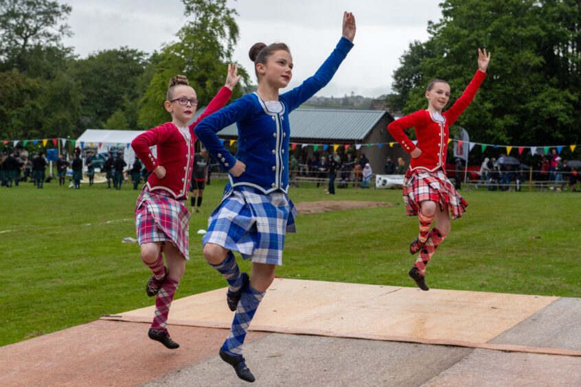 A trio performing in the Highland Dancing competition.