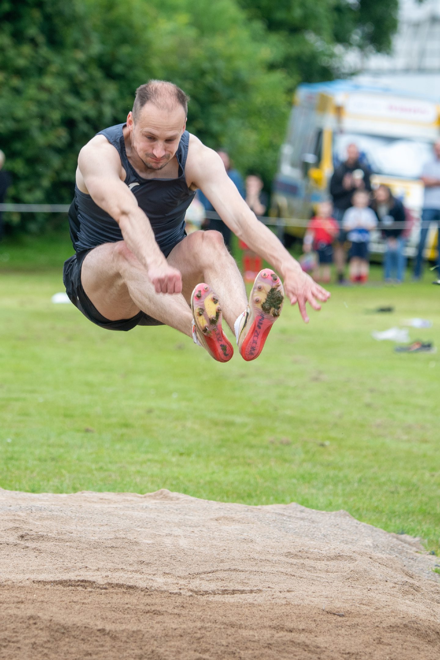 Alan Hamilton competing in the long jump.