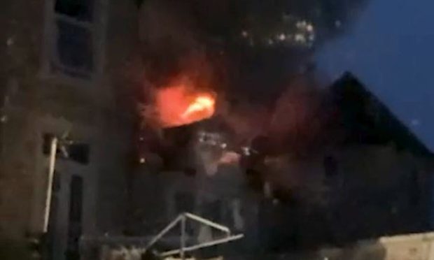 Screenshot of video of flames coming through of Ladyhill House.